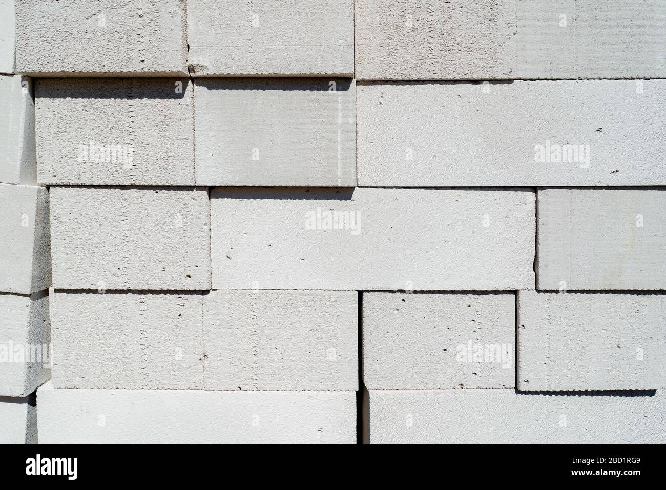 blocks of cellular concrete are stacked in a pile Stock Photo