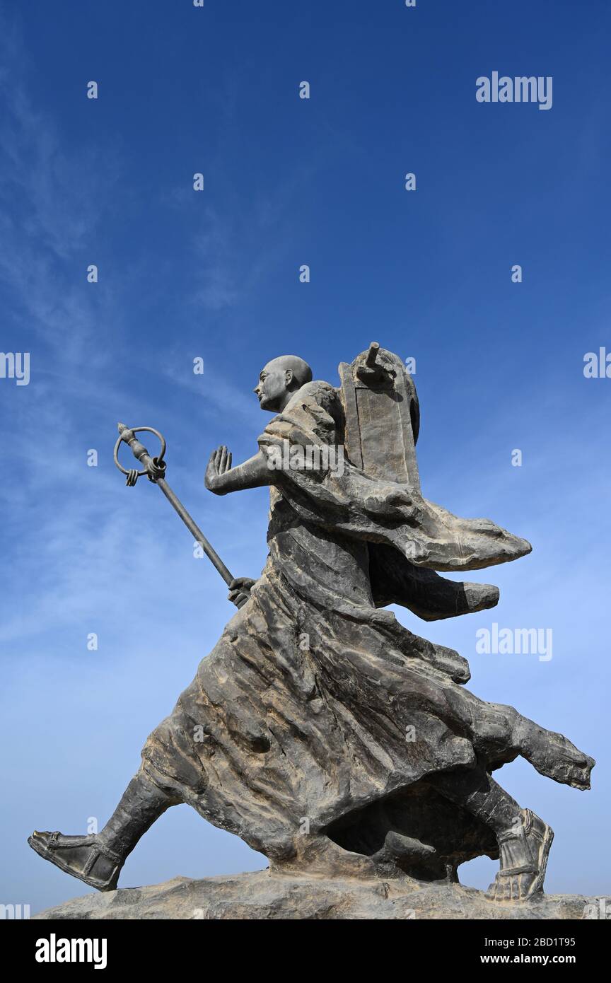 Statue of 7th century monk, Xuanzang, carrying Buddhist sutras, Gaochang ruins, Xinjiang, China, Asia Stock Photo