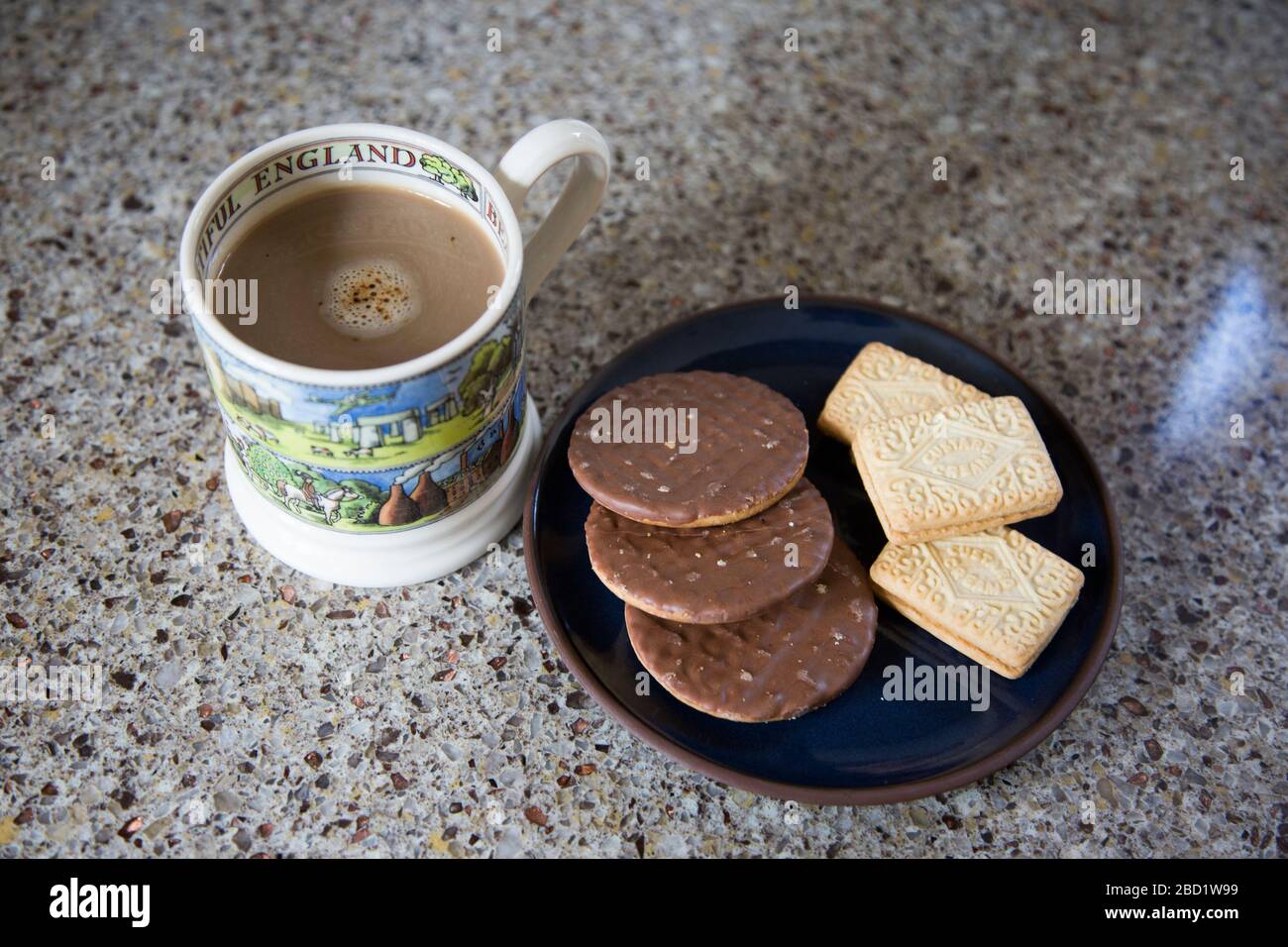 coffee and biscuits on a plate in the kitchen, no people, chocolate and