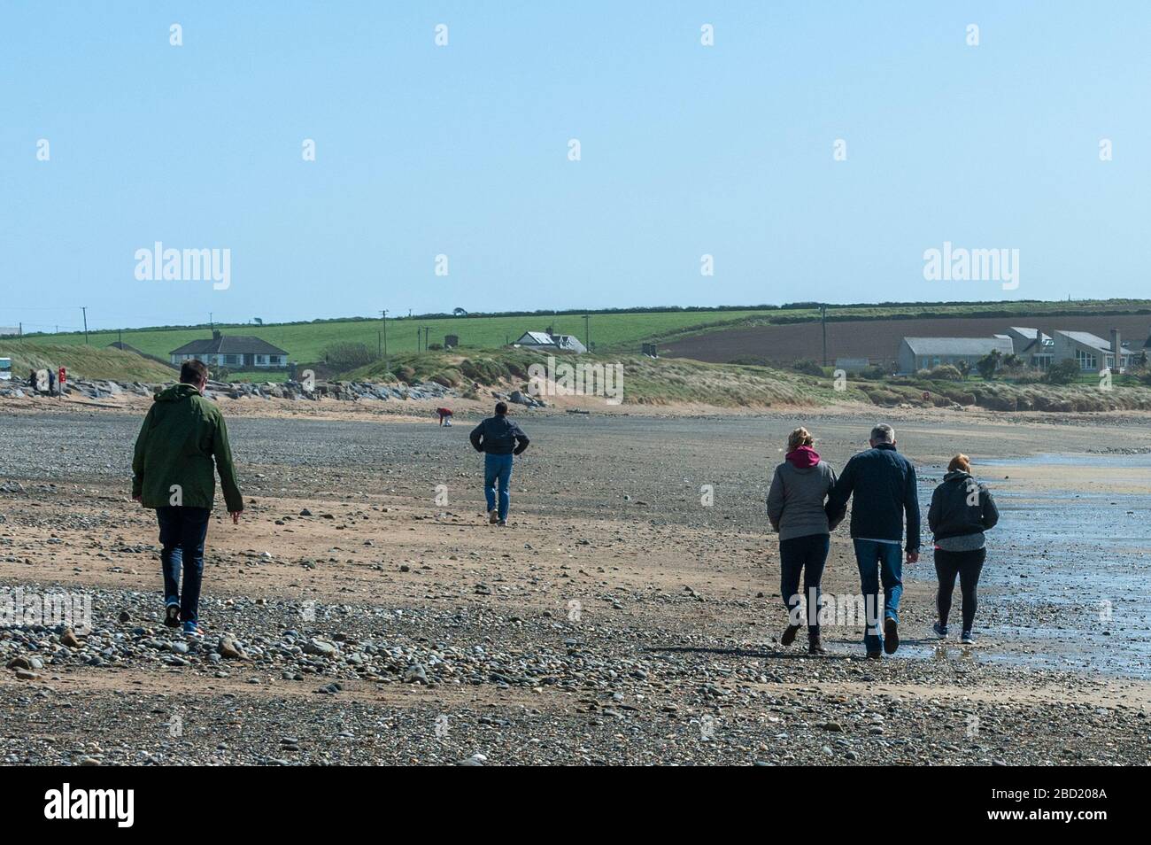 Garrettstown, West Cork, Ireland. 6th Apr, 2020. People were on the beach at Garrettstown today and most were observing the Government's social distancing guidelines issued due to the Covid-19 pandemic. Credit: Andy Gibson/Alamy Live News Stock Photo