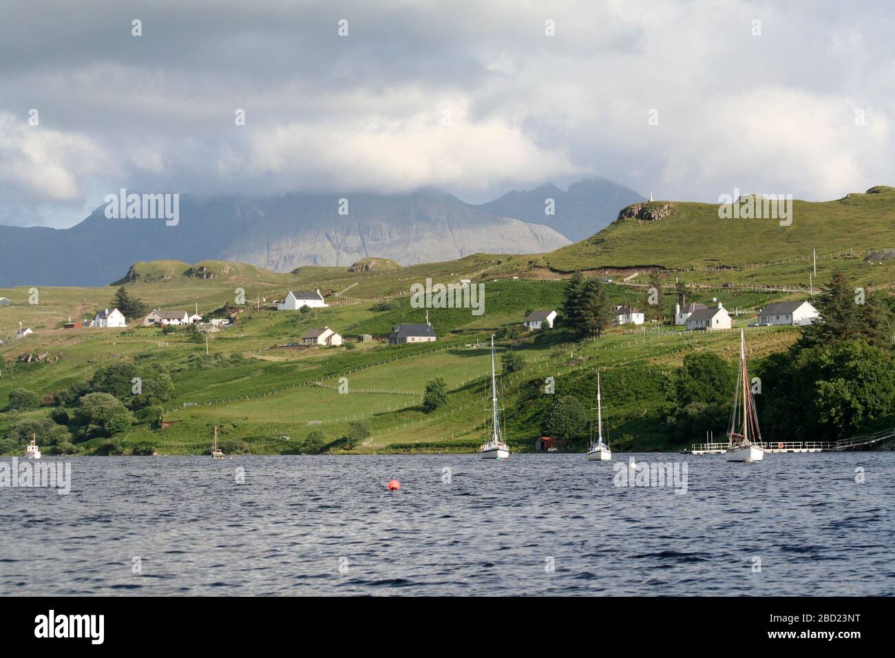 Sailing yachts on moorings at Carbost village, near Talisker distillery, Loch Harport, Isle of Skye, Hebrides, Scotland Stock Photo