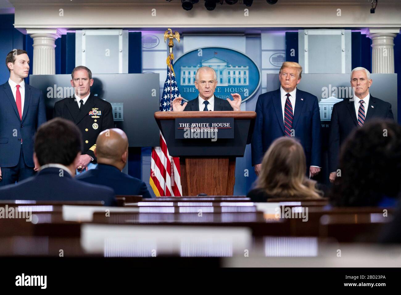 U.S. National Defense Production Act policy coordinator Peter Navarro takes a question from reporters during the daily COVID-19, coronavirus briefing in the Press Briefing Room of the White House April 2, 2020 in Washington, DC. Standing left to right are: Presidential son-in-law Jared Kushner, Rear Adm. John Polowczyk, National Defense Production Act policy coordinator Peter Navarro, President Donald Trump and Vice President Mike Pence. Stock Photo