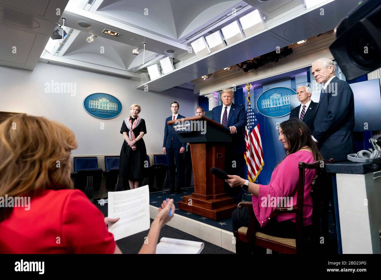 U.S. President Donald Trump takes a question from reporters during the daily COVID-19, coronavirus briefing in the Press Briefing Room of the White House April 2, 2020 in Washington, DC. Standing left to right are: Presidential son-in-law Jared Kushner, Rear Adm. John Polowczyk, Vice President Mike Pence and National Defense Production Act policy coordinator Peter Navarro. Stock Photo