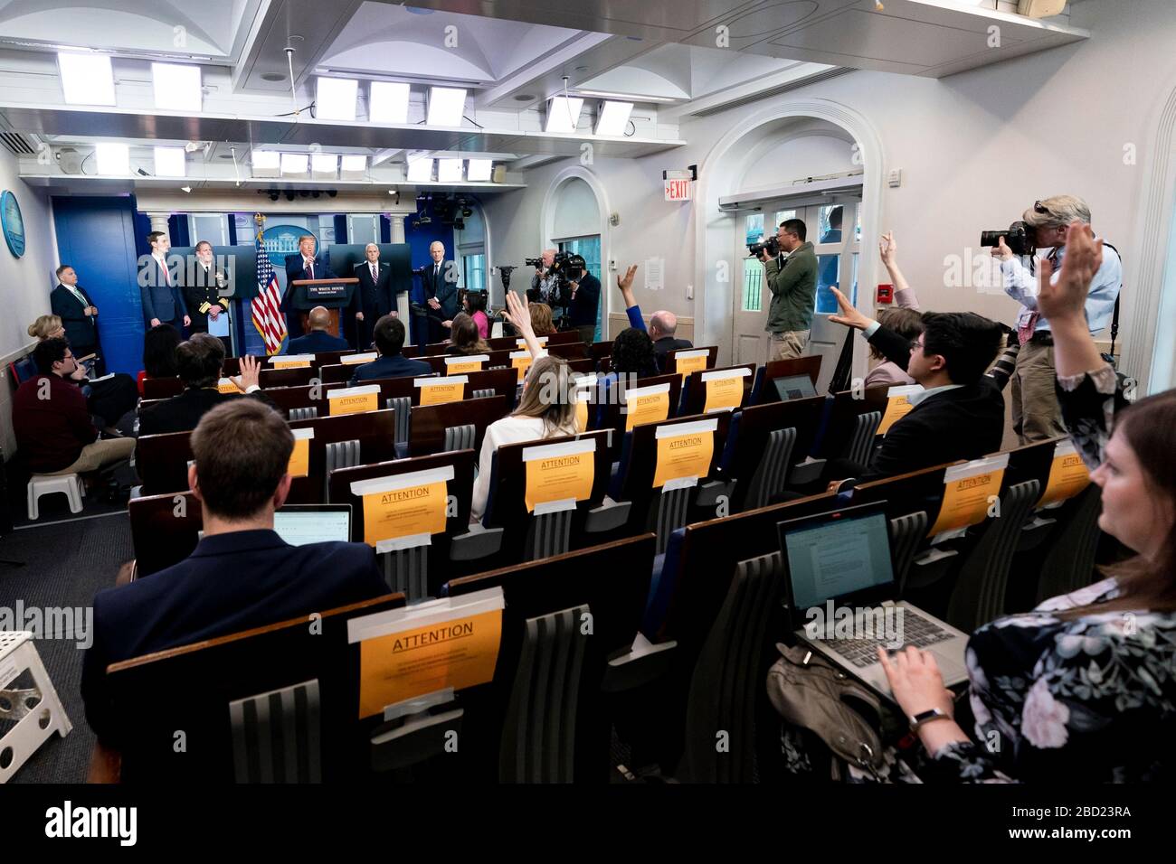 U.S. President Donald Trump takes a question from reporters during the daily COVID-19, coronavirus briefing in the Press Briefing Room of the White House April 2, 2020 in Washington, DC. Standing left to right are: Presidential son-in-law Jared Kushner, Rear Adm. John Polowczyk, Vice President Mike Pence and National Defense Production Act policy coordinator Peter Navarro. Stock Photo