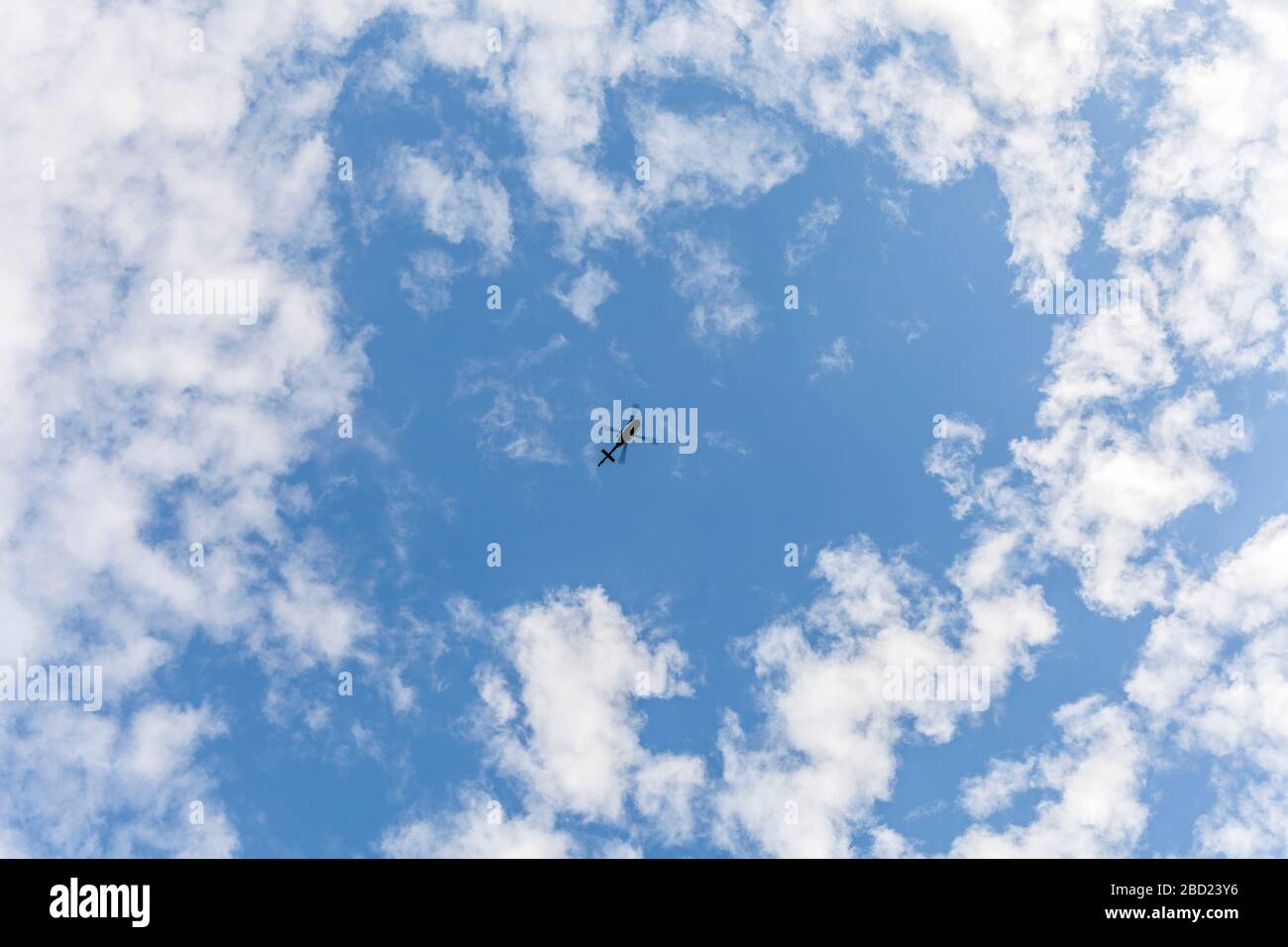 Airborne helicopter viewed from below Stock Photo