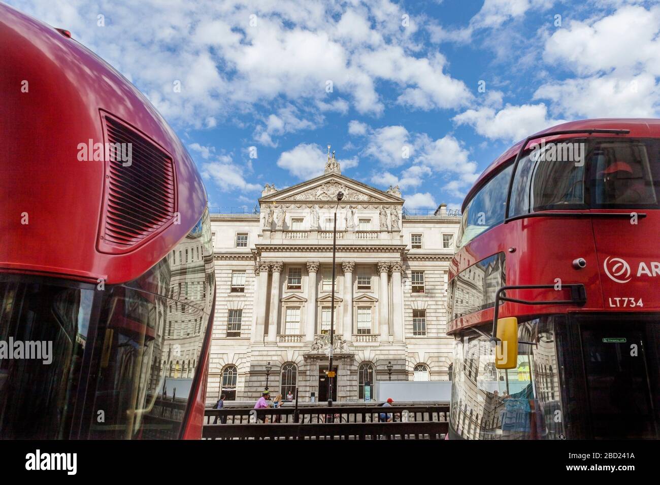 Somerset House between two London red buses, London Stock Photo