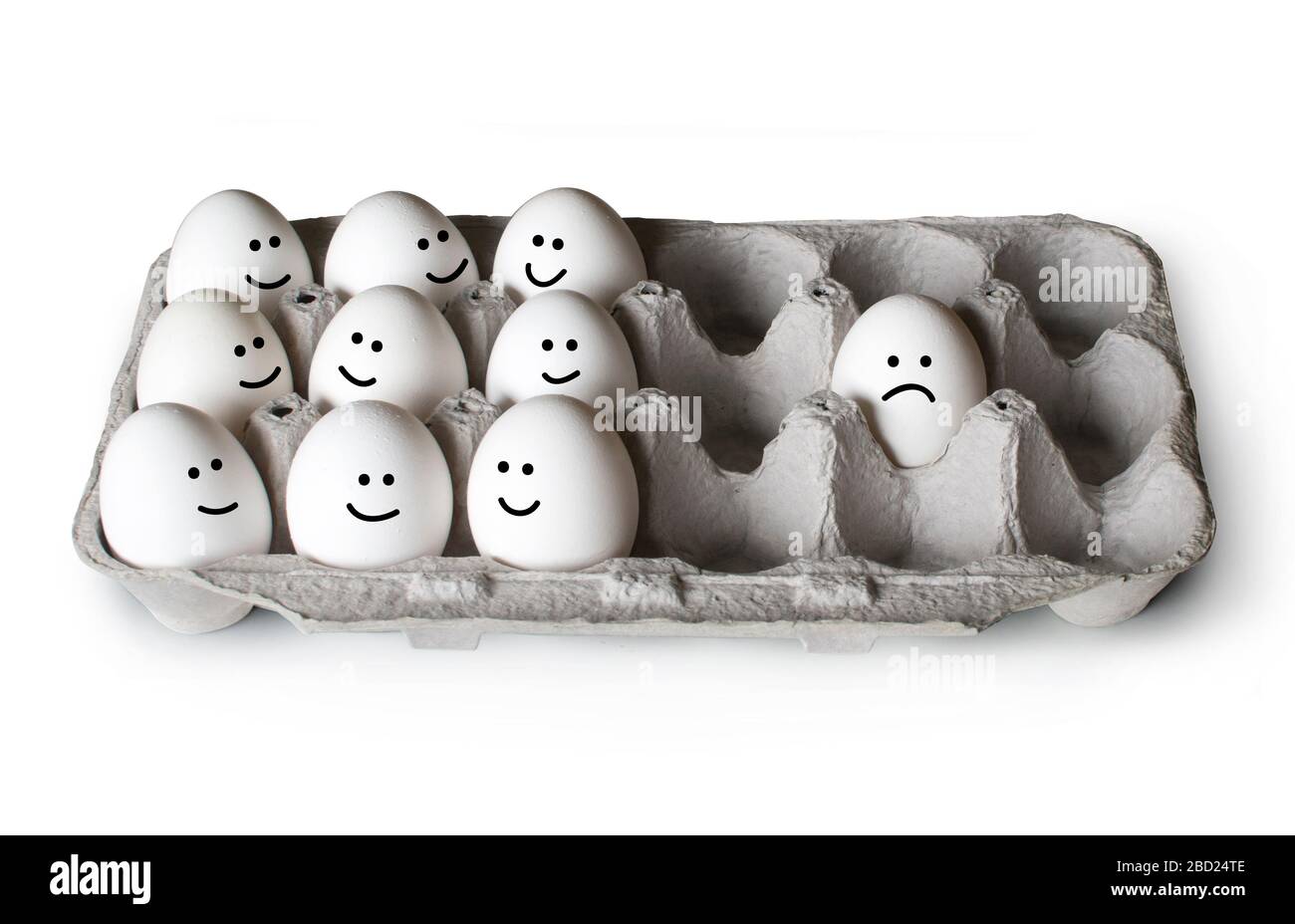 White eggs in a carton, one separated from the crowd, social distancing concept Stock Photo