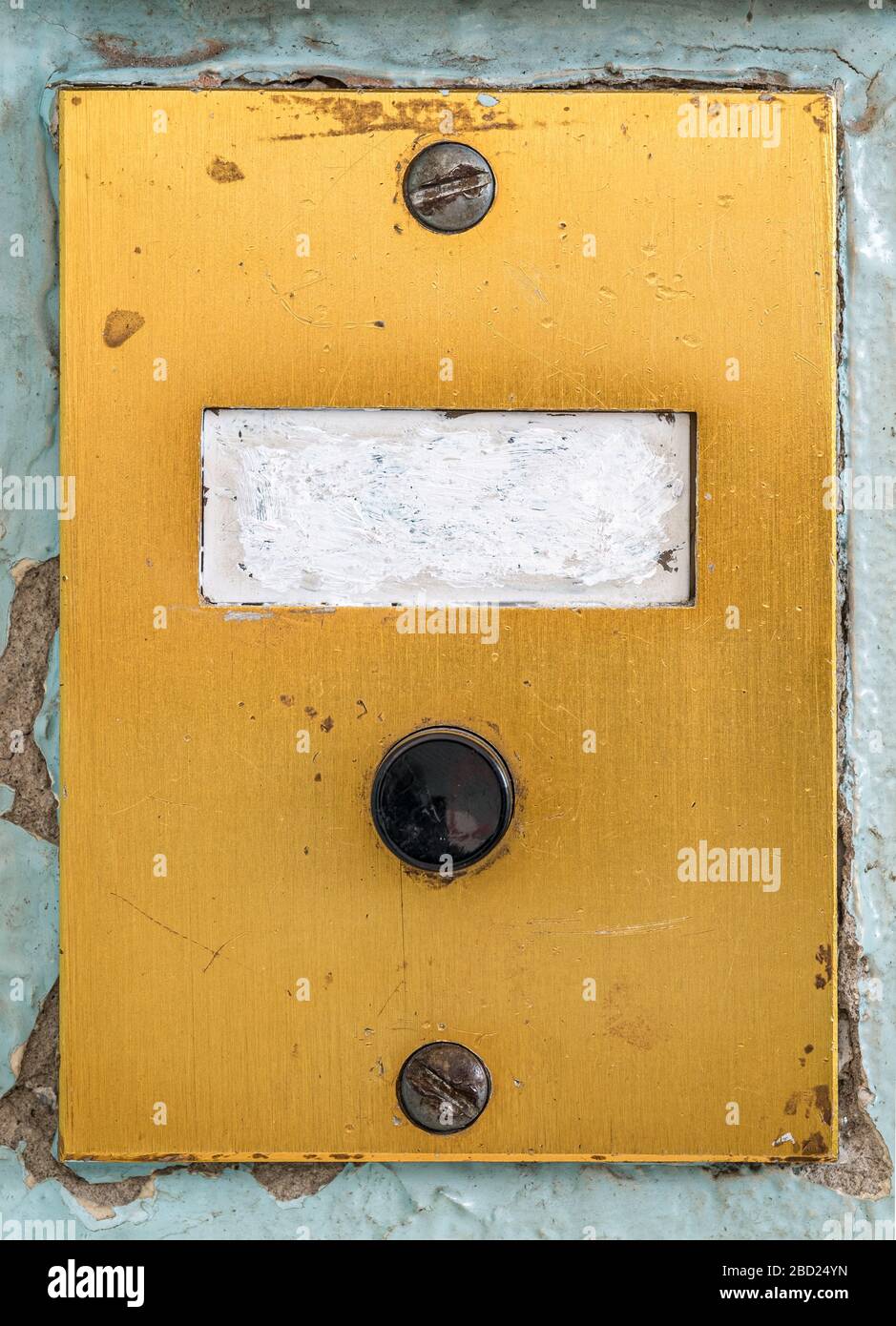 old doorbell plate with blank erased label Stock Photo