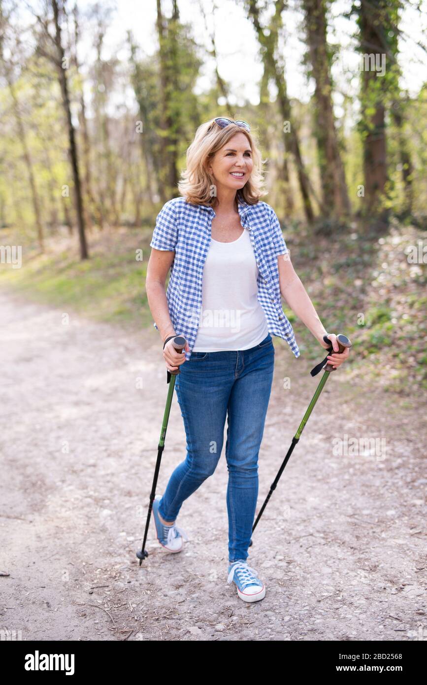 Attractive older woman walking hi-res stock photography and images - Alamy