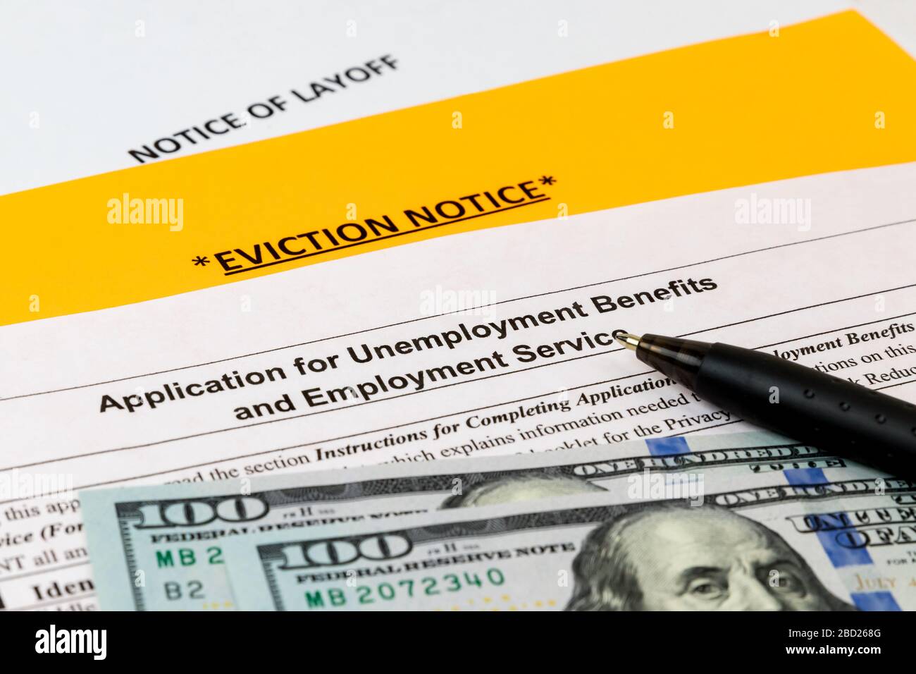 Job layoff notice, application for unemployment insurance benefits, eviction notice. Covid-19 coronavirus stay at home order effect on economy Stock Photo