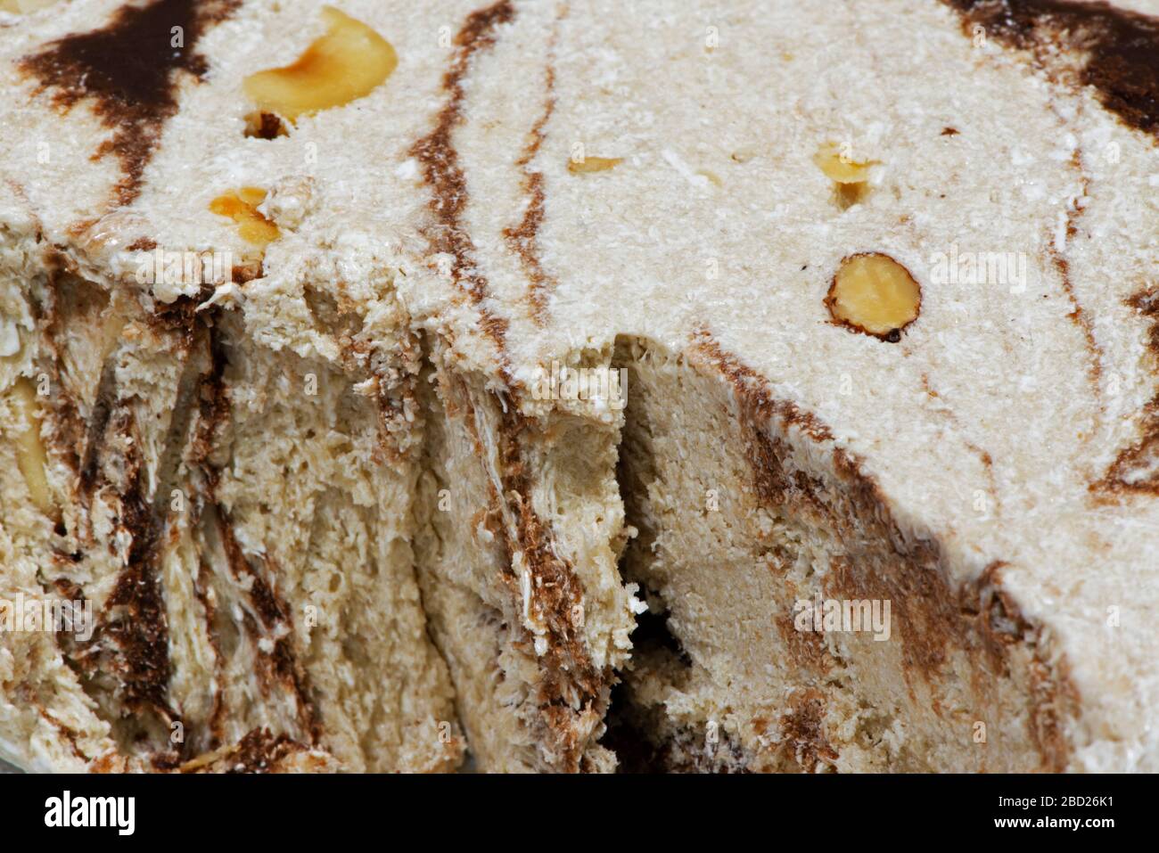 Macro photography of vanilla, chocolate halvah with almonds Stock Photo