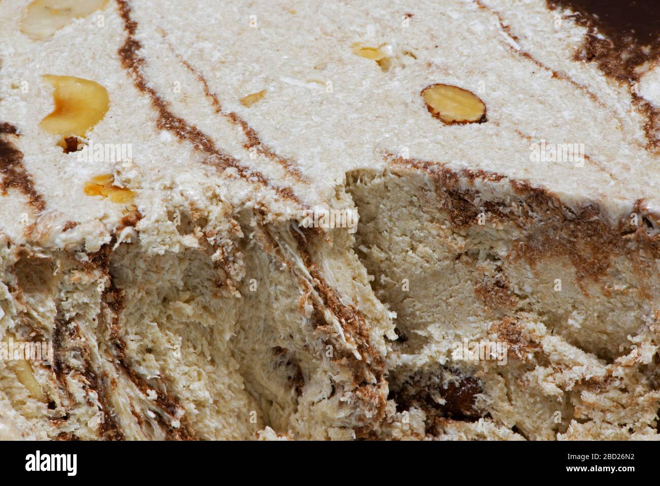 Macro photography of vanilla, chocolate halvah with almonds Stock Photo