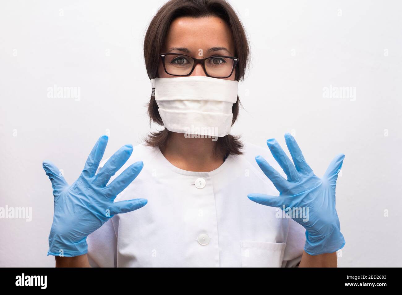 Nurse wearing gloves mask hi-res stock photography and images - Alamy