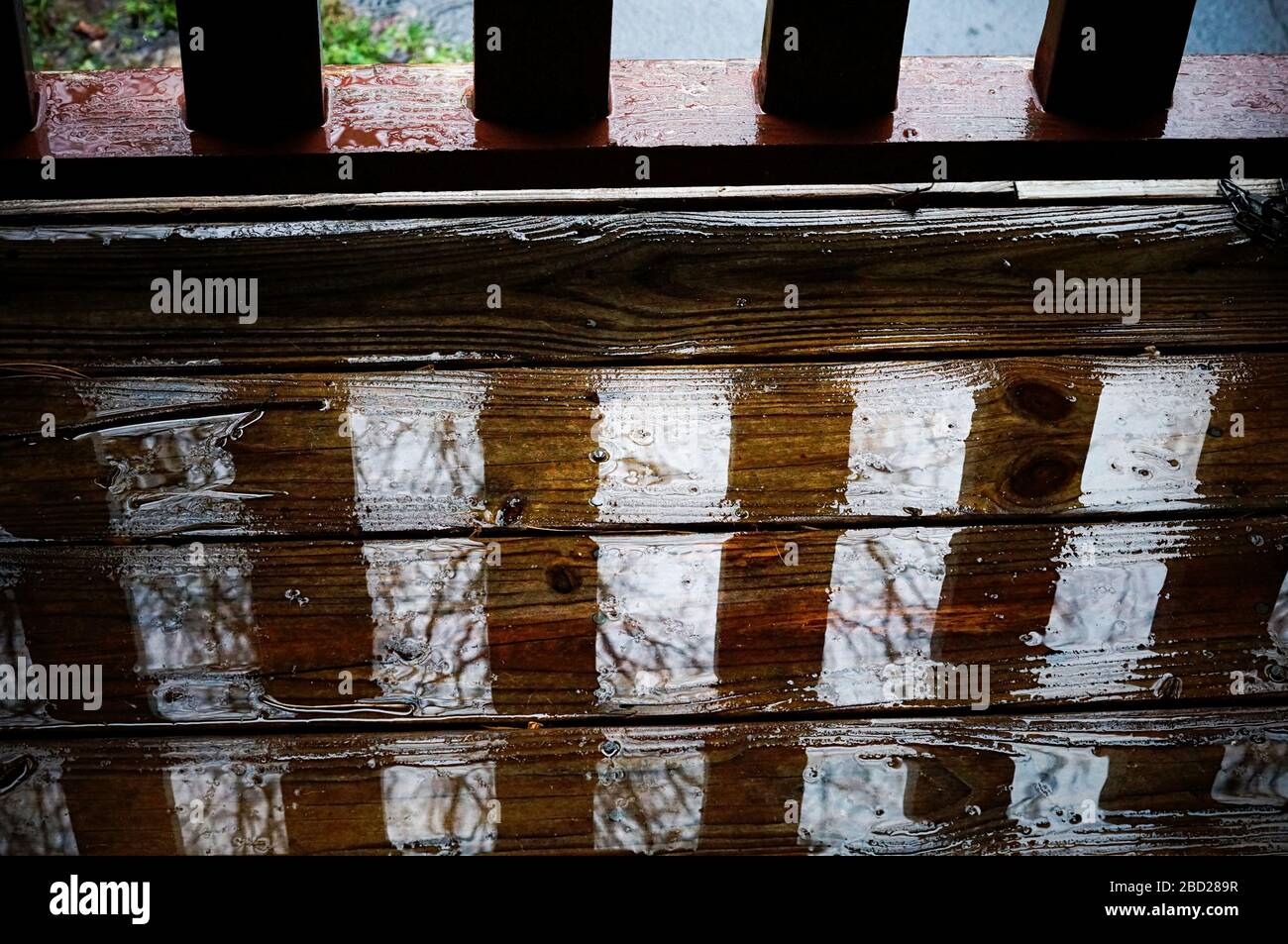 Wooden porch gets wet by rain Stock Photo Alamy
