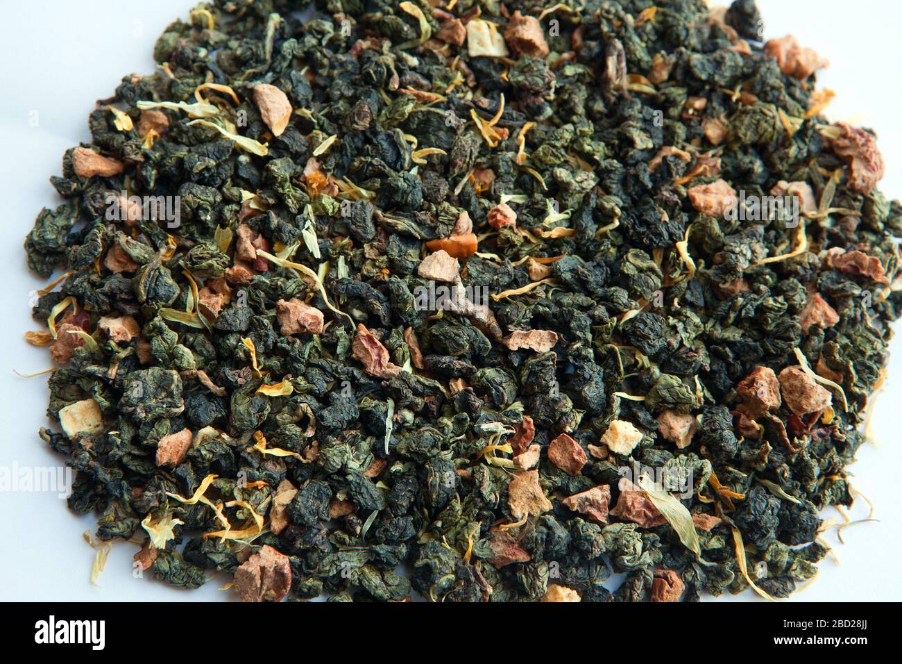 dried green tea leafs with peaches. Green fruit tea with dry peach and