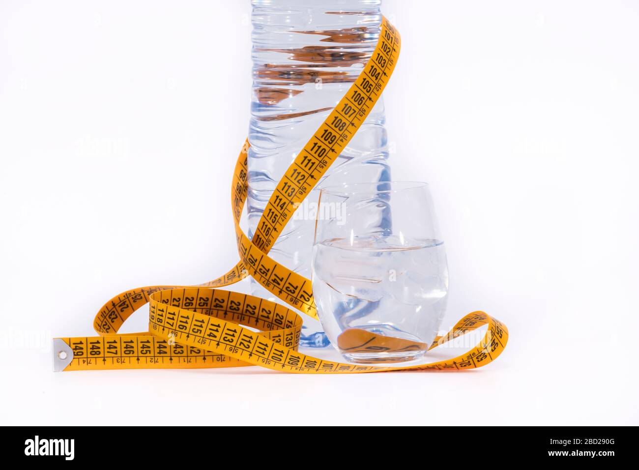 yellow tape measure and a water bottle Stock Photo