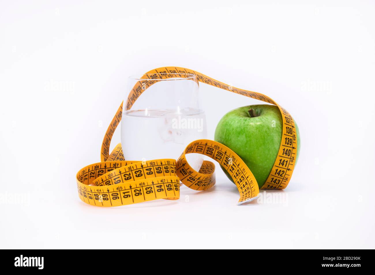 yellow tape measure and a green apple Stock Photo