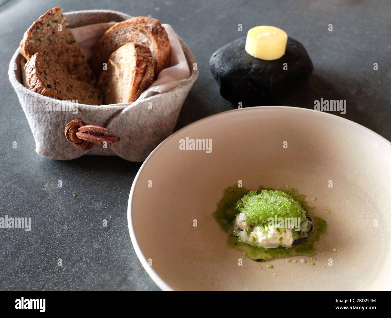 Oyster starter with homemade bread and butter at Michelin-starred Loam restaurant in Galway City, County Galway, Ireland Stock Photo