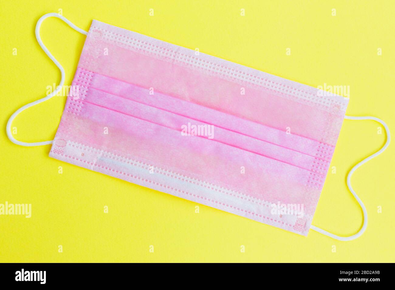 Download One Medical Mask On A Yellow Background Stock Photo Alamy PSD Mockup Templates