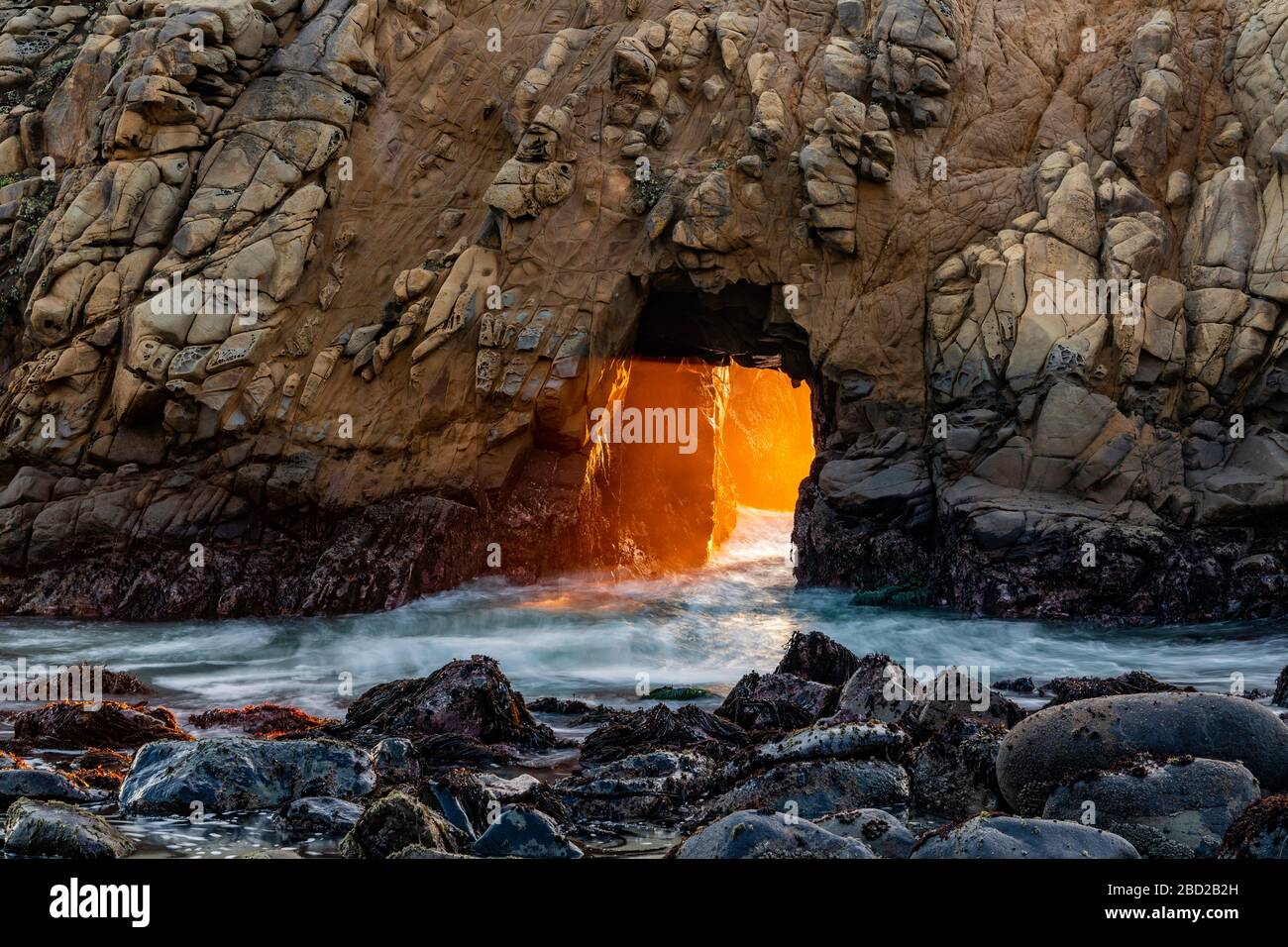 Sunset through Keyhole, Pfeiffer Beach, Big Sur, California, USA Stock