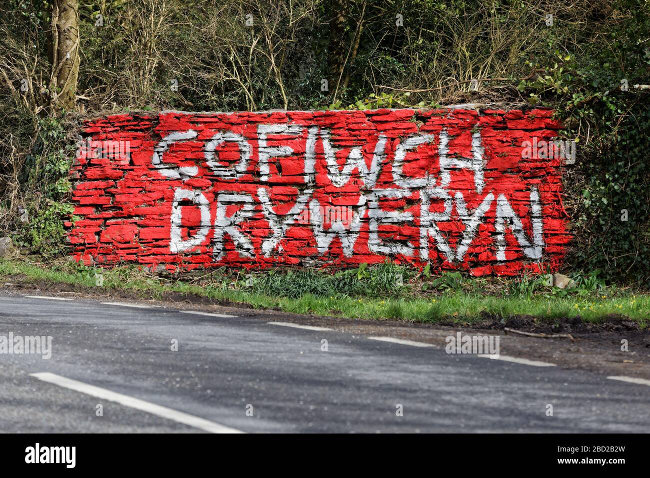 A 'Cofiwch Dryweryn' (Remember Tryweryn) graffiti on the A4302 Talley Road in the outskirts of Llandeilo, Wales, UK. Thursday 12 March 2020 Stock Photo