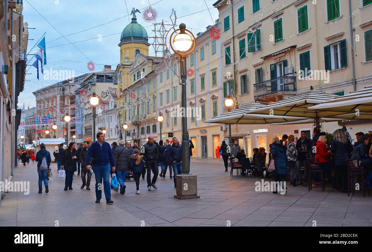 Rijeka, Croatia - December 24th 2019. Locals and visitors shop and drink at a Christmas street stall on Korzo, the main shopping street in the centre Stock Photo