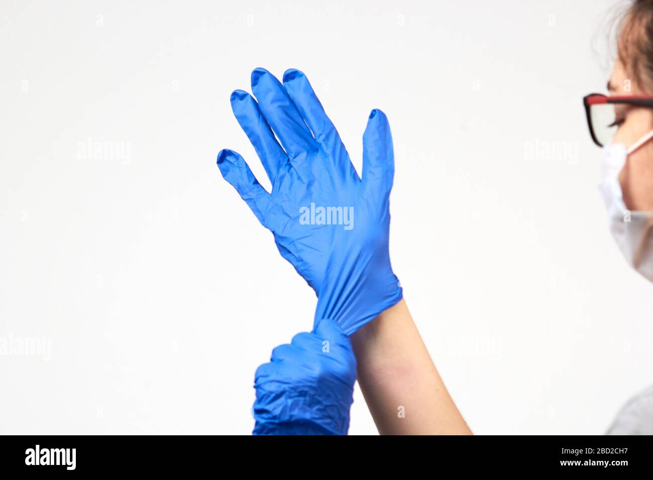 Doctor puts on safety glasses hi-res stock photography and images - Alamy