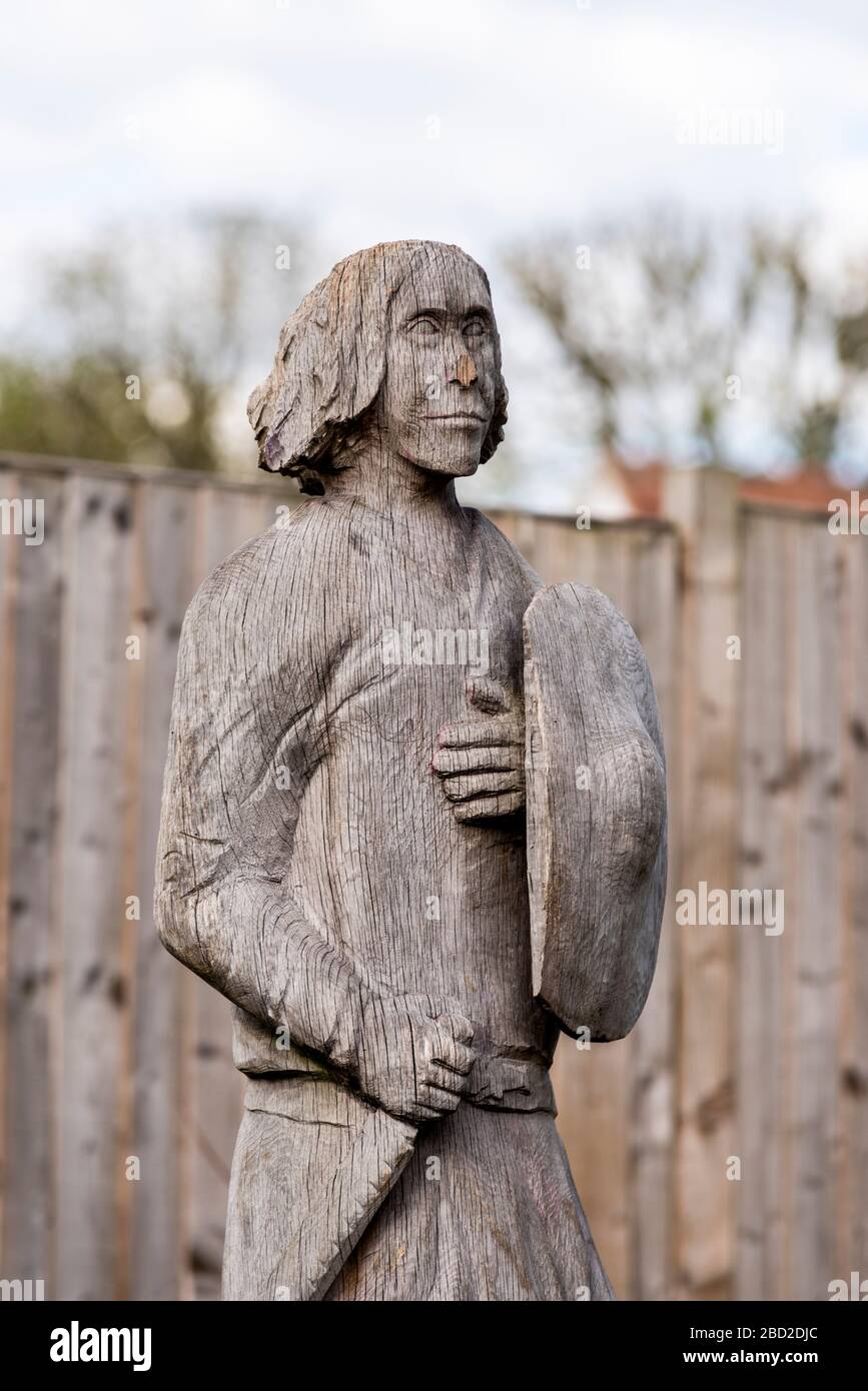 Carved wooden figure on the Prittle Brook Green Way urban path, sculptured by chainsaw artist Ben Loughrill. Saxon warrior carving Stock Photo