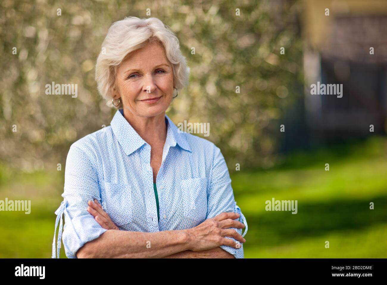 Hoop earrings and mature woman hi-res stock photography and images - Alamy