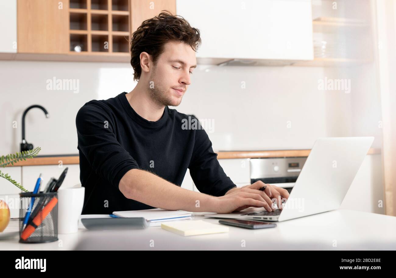 Young man working at home. Home office, remotely working concept Stock Photo