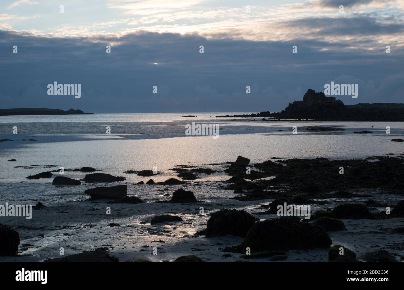 Sunset over Annet island viewed from Periglis beach on St Agnes, Isles of Scilly Stock Photo