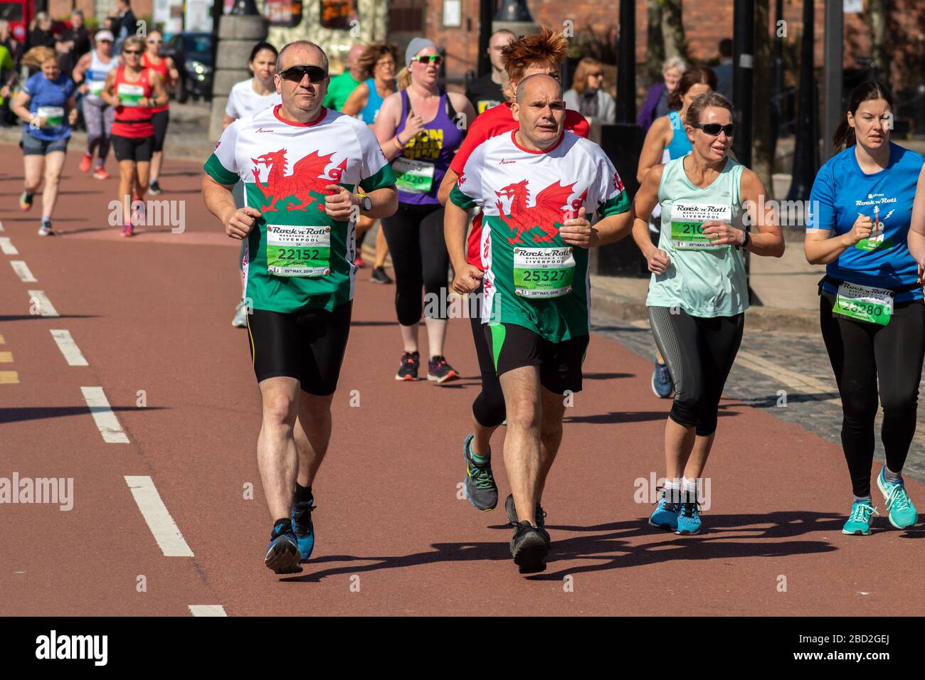 Runners wearing Wales shirts, Rock 'n' Roll 5K, Salthouse Quay, Liverpool Stock Photo