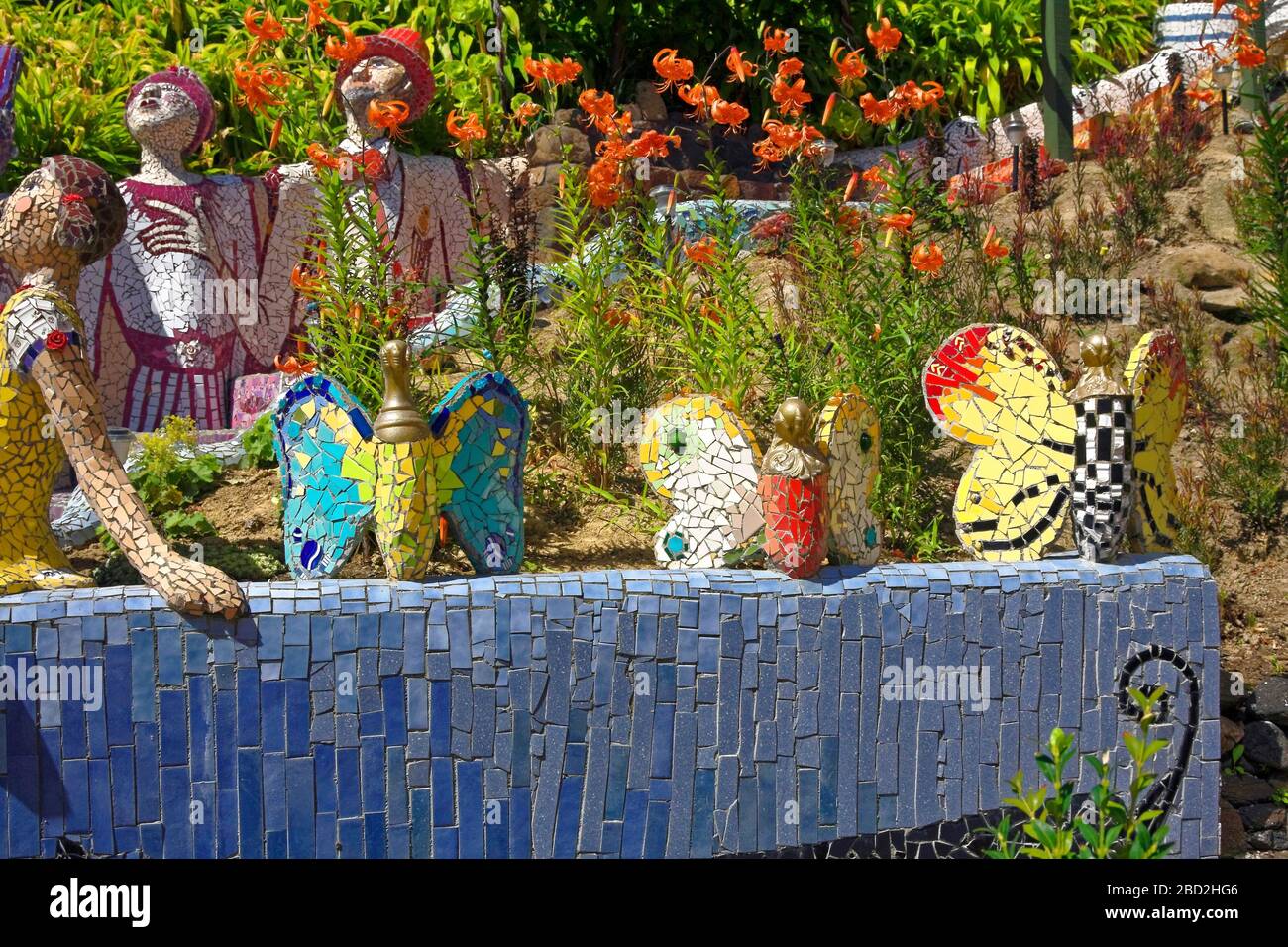 garden sculptures, mosaic tile pieces, butterflies, people statues