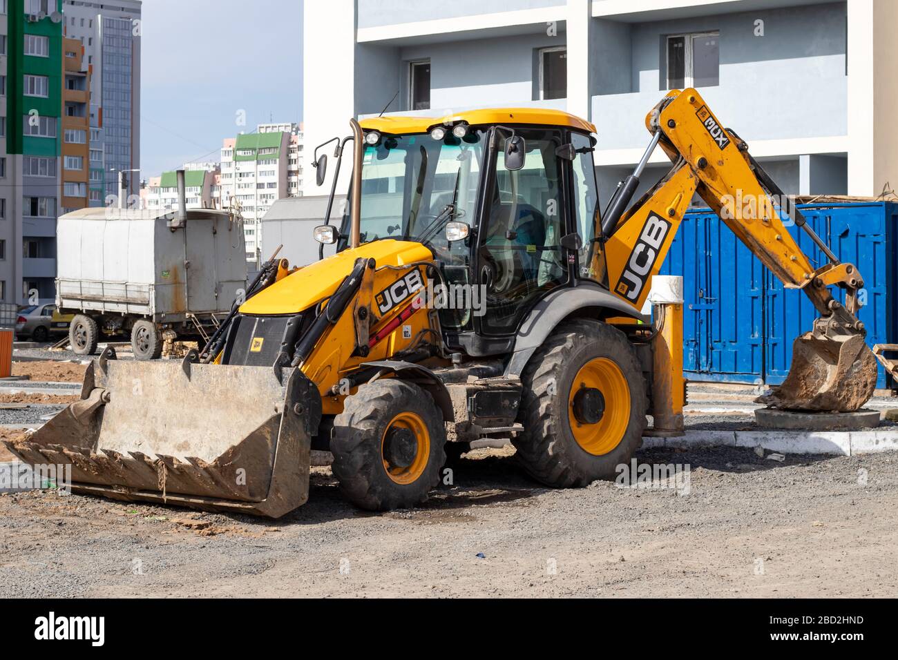 Kharkiv, Ukraine, March 29, 2020: The dirty yellow JCB tractor at the construction site. Illustrative editorial Stock Photo