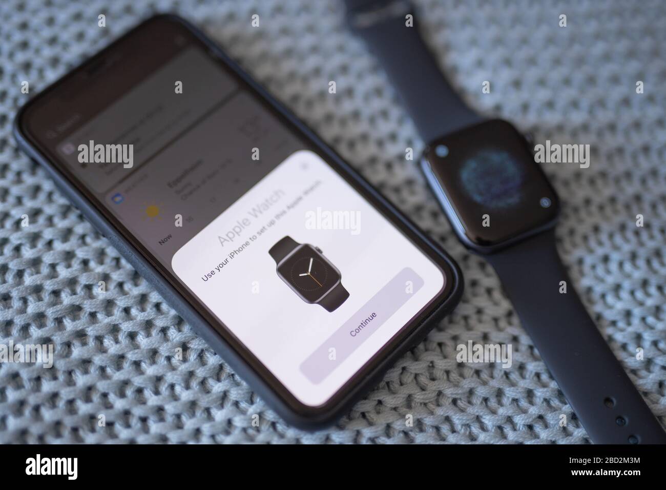 Pairing new Apple Watch Series 5 with Iphone XS Stock Photo
