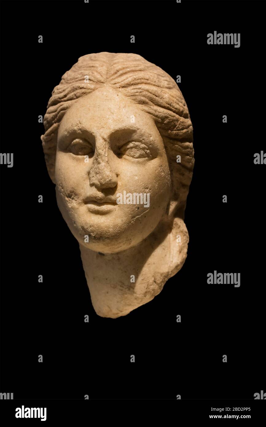 Dion park, Greece - May 2, 2016: Ancient greek face statue isolated on black background Stock Photo