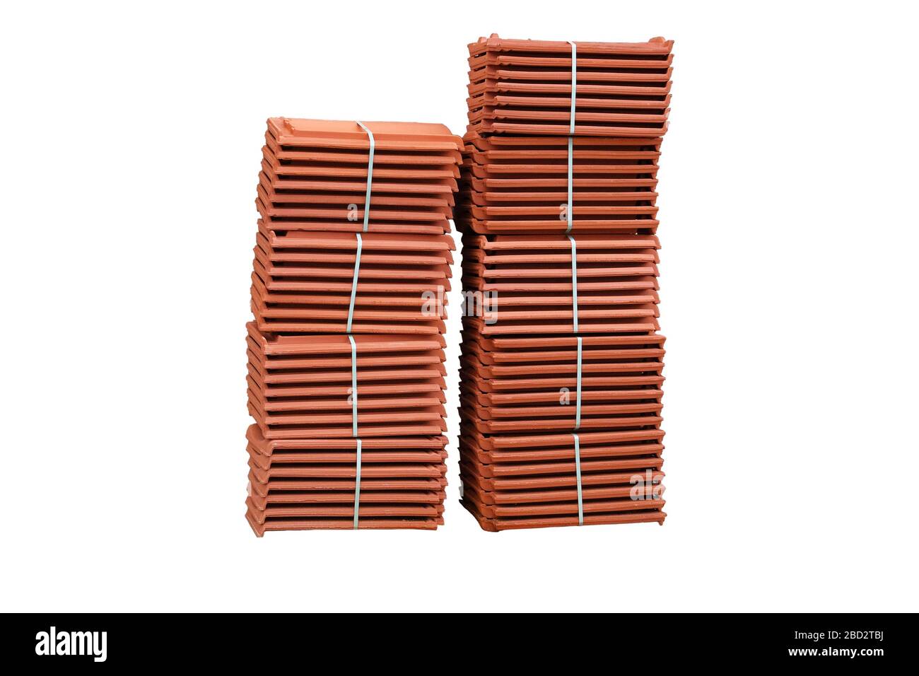 Pile of terracotta new roofing tiles packaged. Isolated on white background. Stock Photo