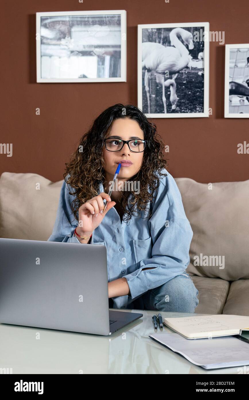 A beautiful young girl working at her home Stock Photo - Alamy