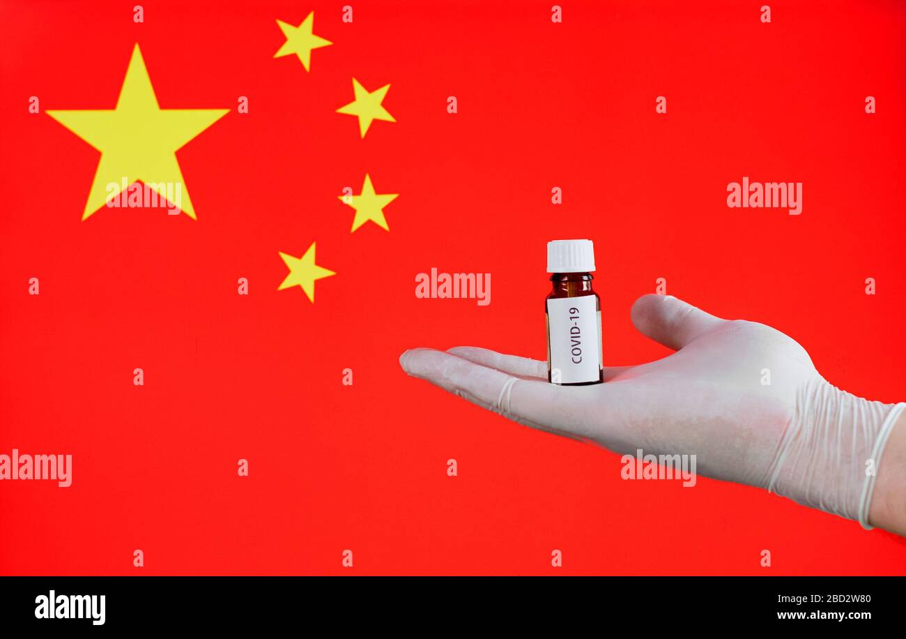 Covid-19 Coronavirus in the China. Vaccine on the background of the China flag. Stock Photo