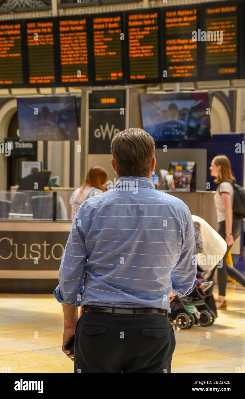 LONDON, ENGLAND JULY 2018 Man in shirtsleeves standing on the
