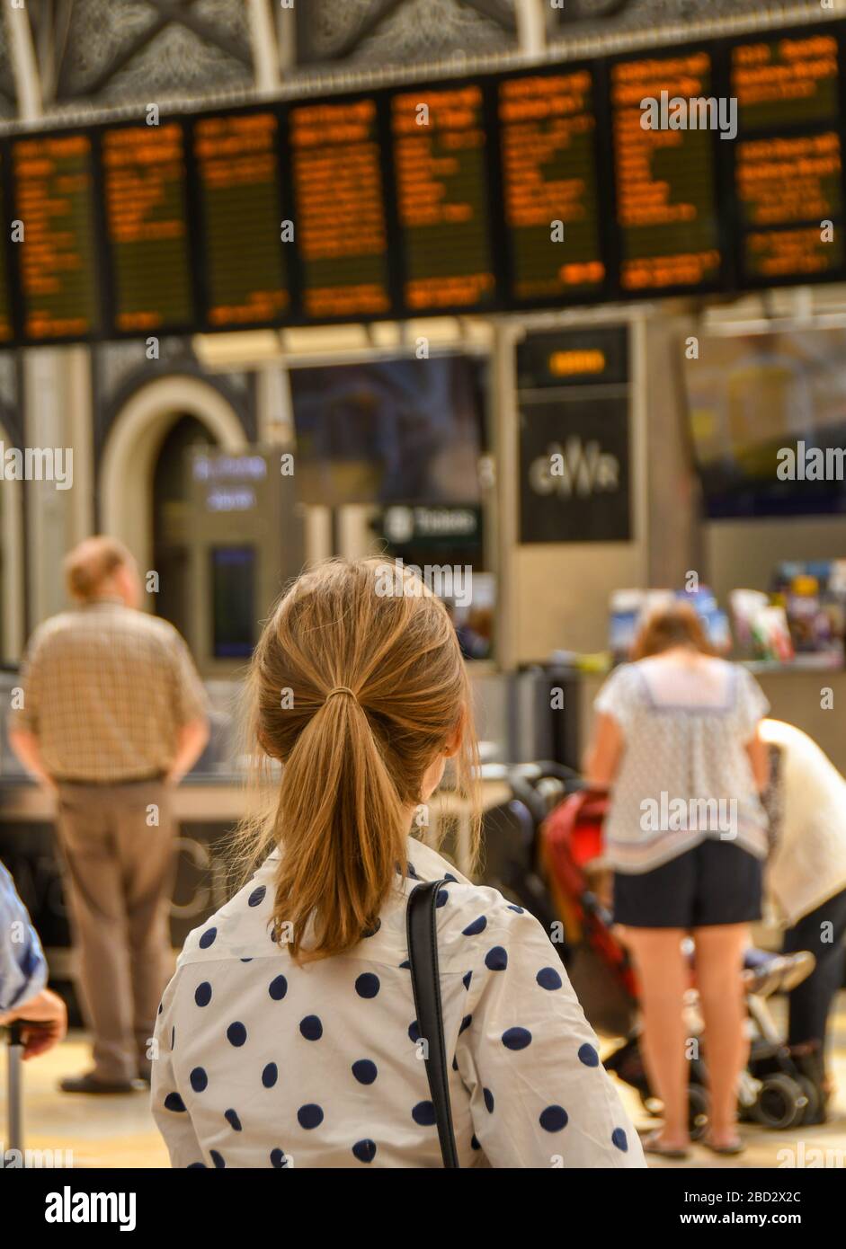 LONDON, ENGLAND JULY 2018 Young lady with hair in a pony tail at