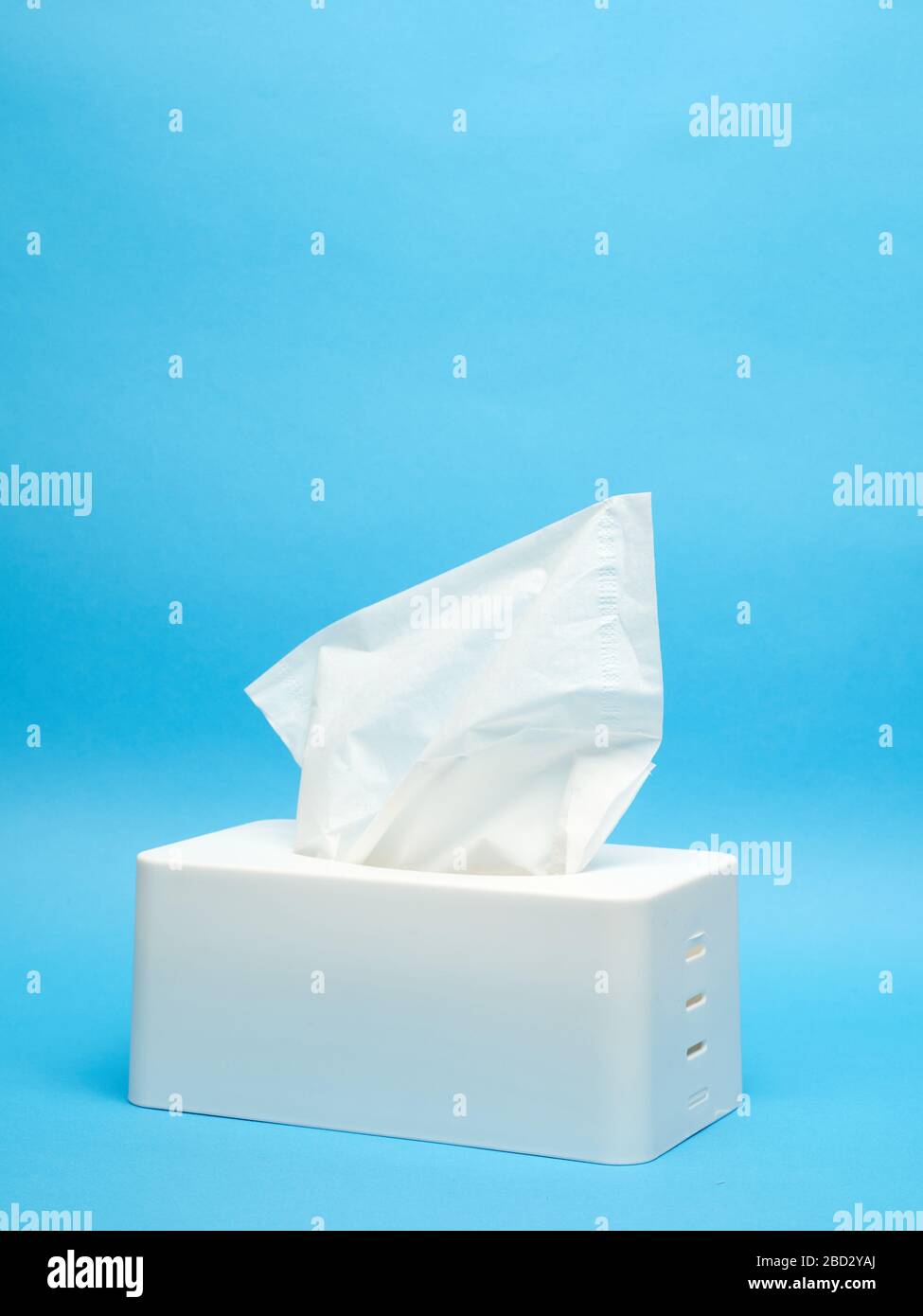 White napkin holder on minimalistic blue background Stock Photo