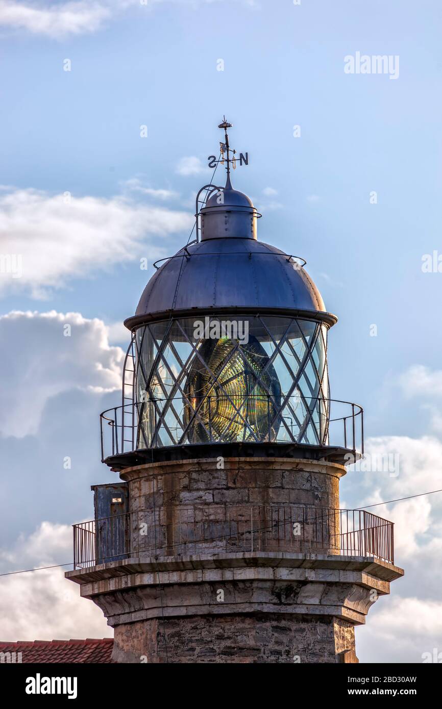 Lantern of the lighthouse of Cabo de Peñas in a cloudy day. Asturias, Spain. Stock Photo