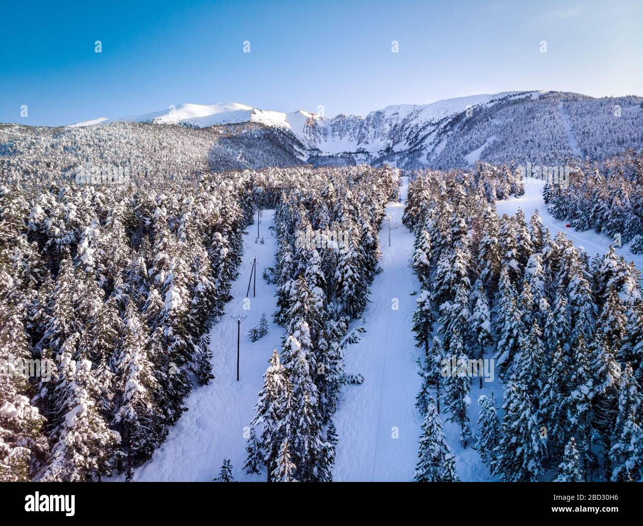 Aerial view of ski resort and snowy mountain in the pyrenees orientales ...