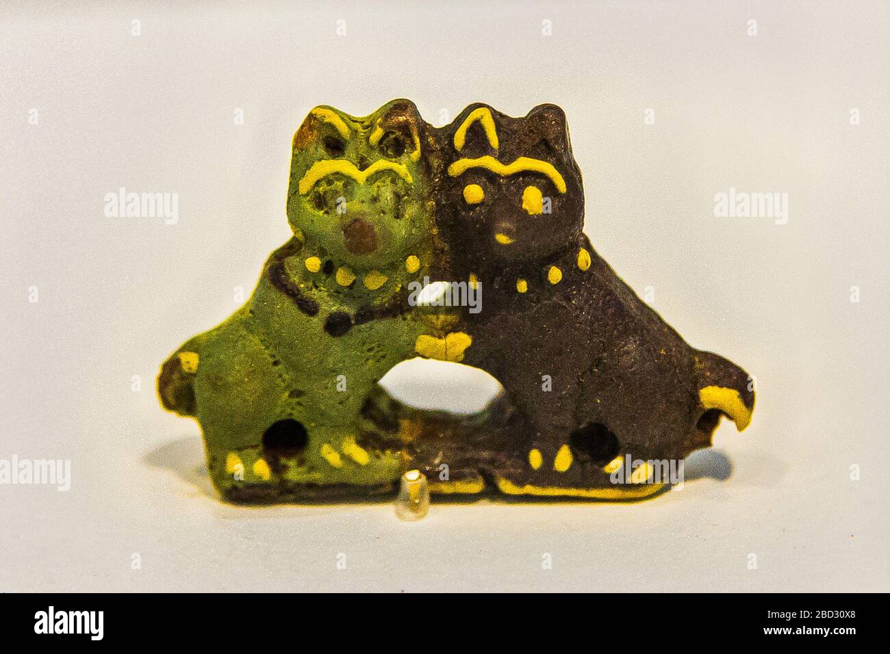 Exhibition 'The animal kingdom in Ancient Egypt', Louvre-Lens museum. Amulet with 2 dogs, Roman period, faience. Stock Photo