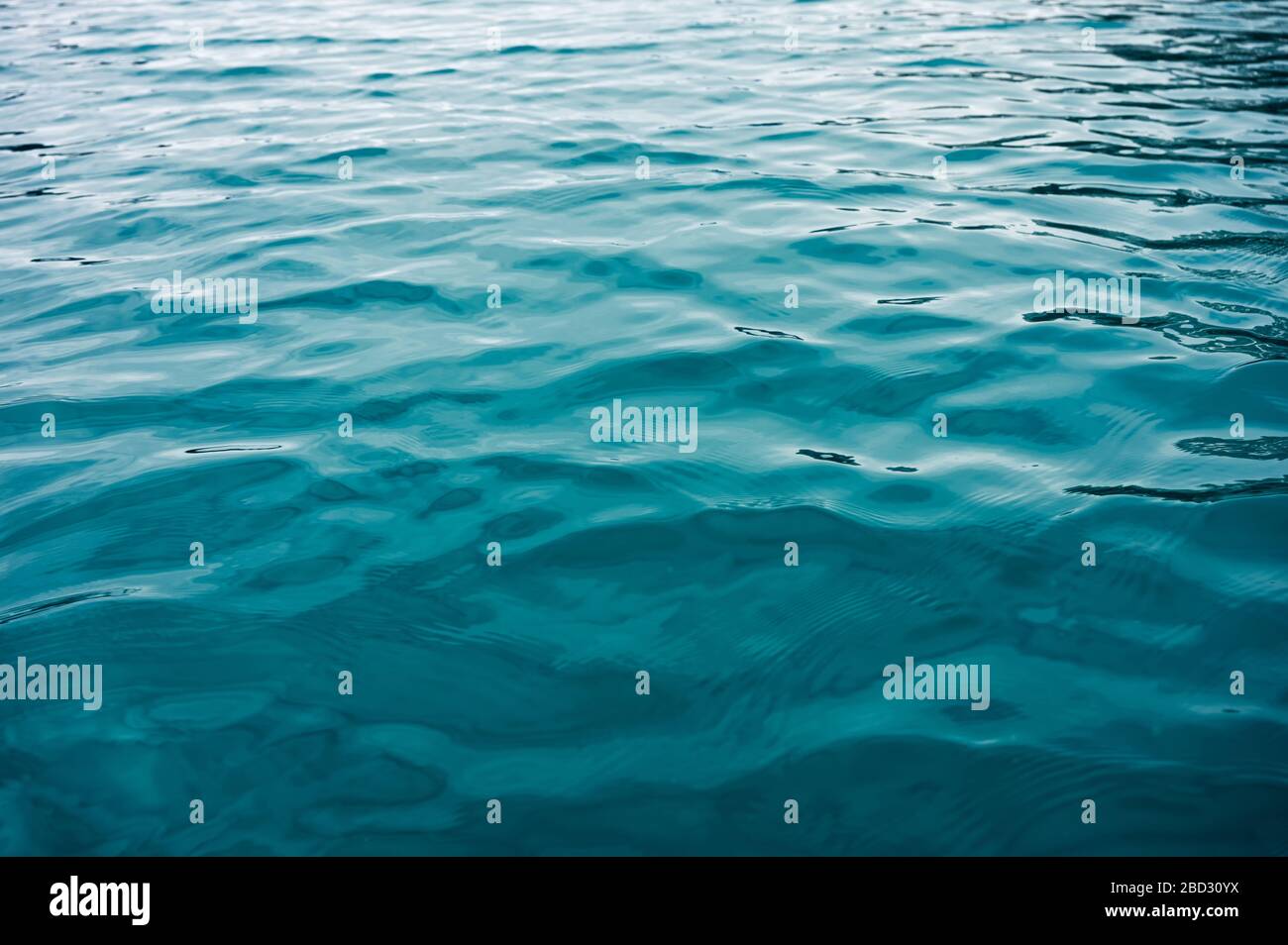 Turquoise ripple water surface on lake background Stock Photo