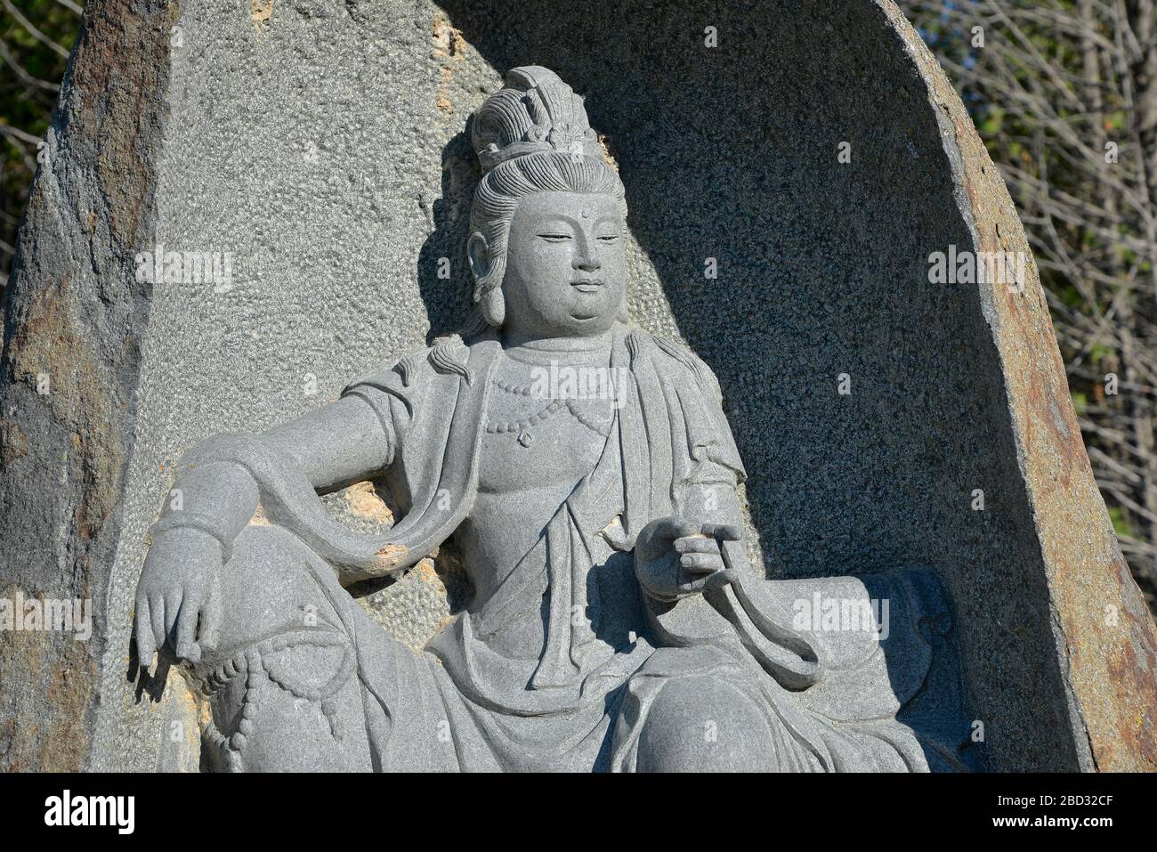 Stone statue of Buddha (sitting posture ) at Buddhist temple in Bethany