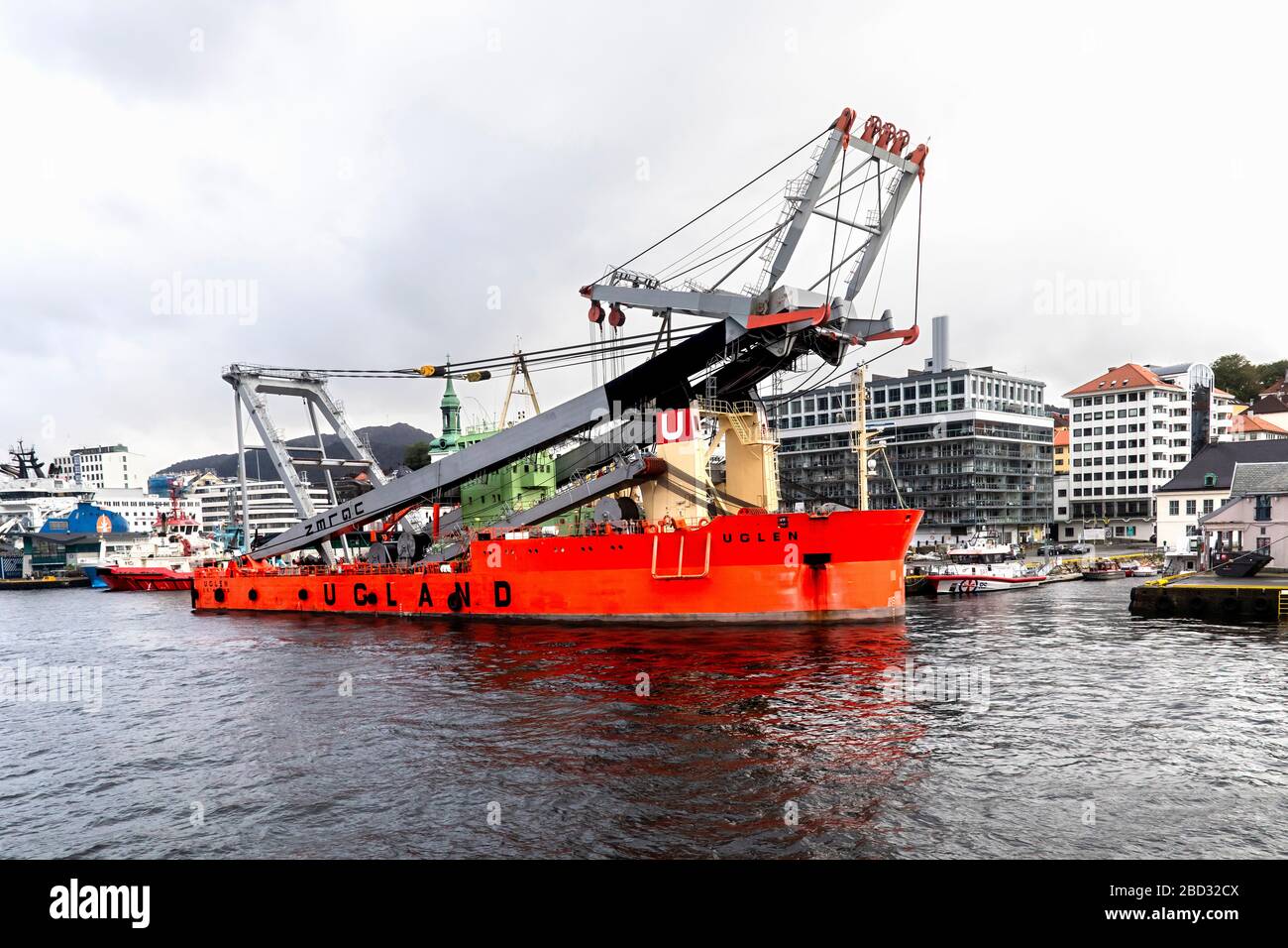 Heavy lift crane vessel Uglen moored in port of Bergen, Norway. A rainy