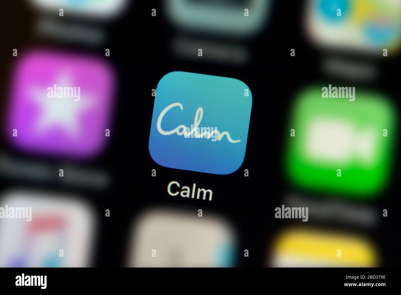 A close-up shot of the Calm app icon, as seen on the screen of a smart phone (Editorial use only) Stock Photo