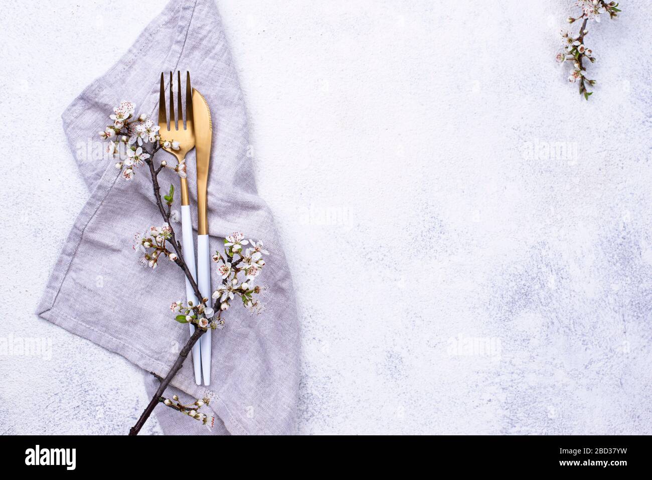 Spring table setting with blooming branch Stock Photo